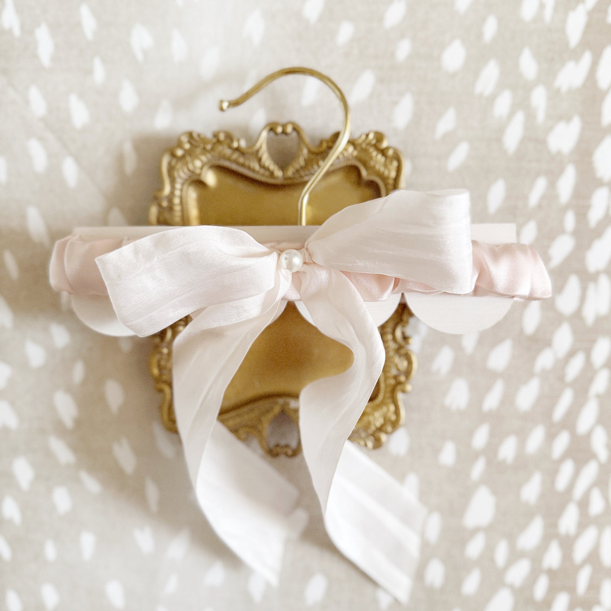 Blush Pink Wedding Garter for Bride with hand tied silk ribbon and pearl detailing by Big Rock Bridal