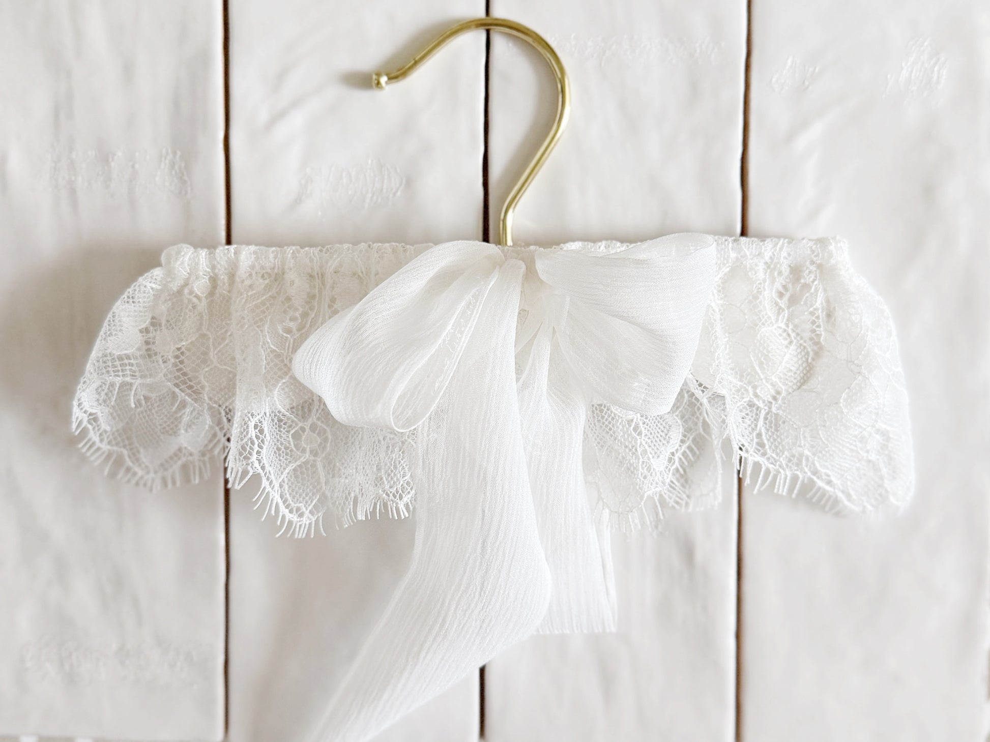 White chantilly lace wedding garter with silk bow