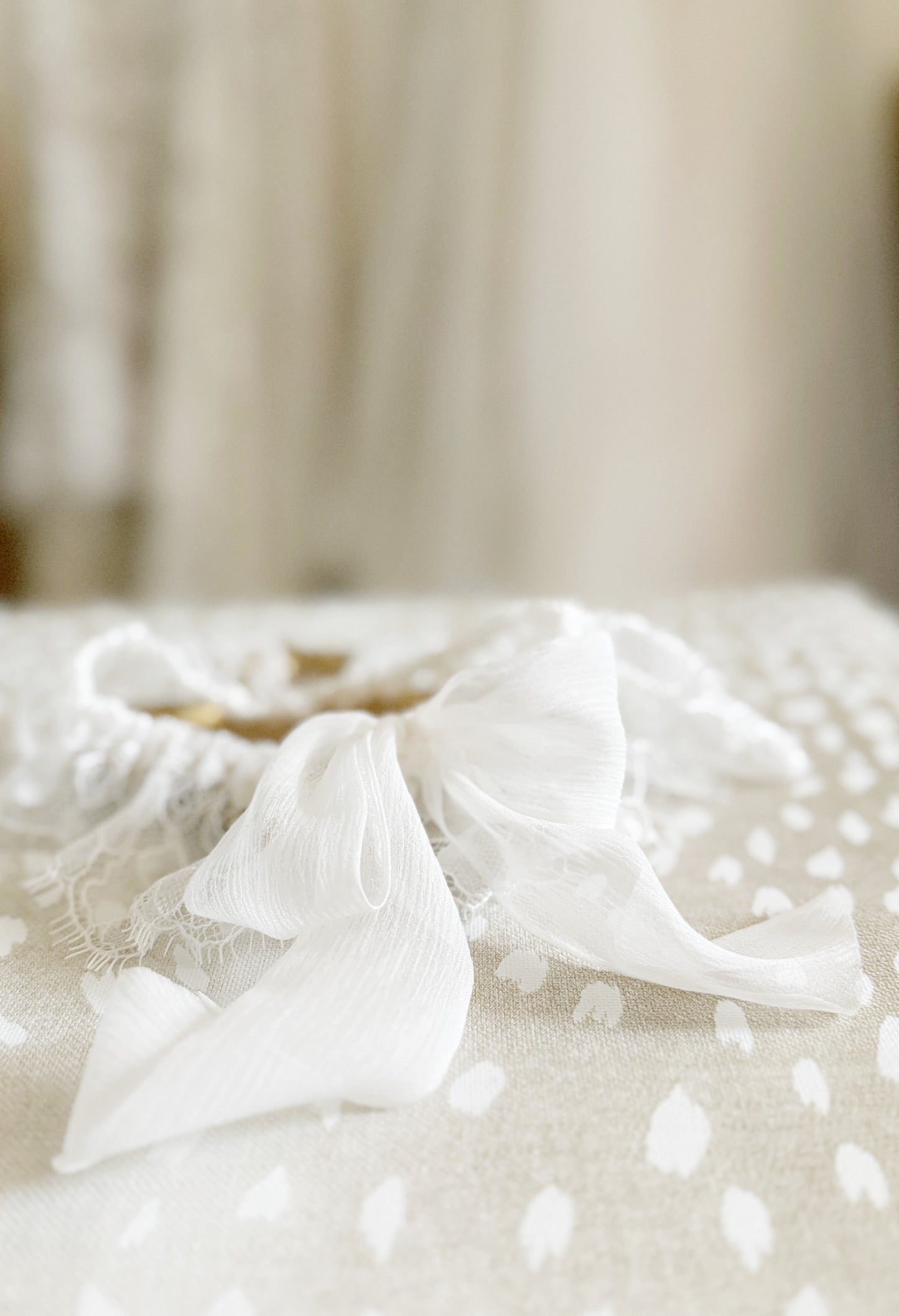 Soft Chantilly Lace bridal garter with a silk bow by Big Rock Bridal